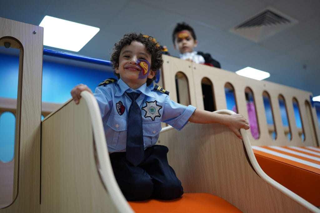 a boy on the slide at kids castle event

